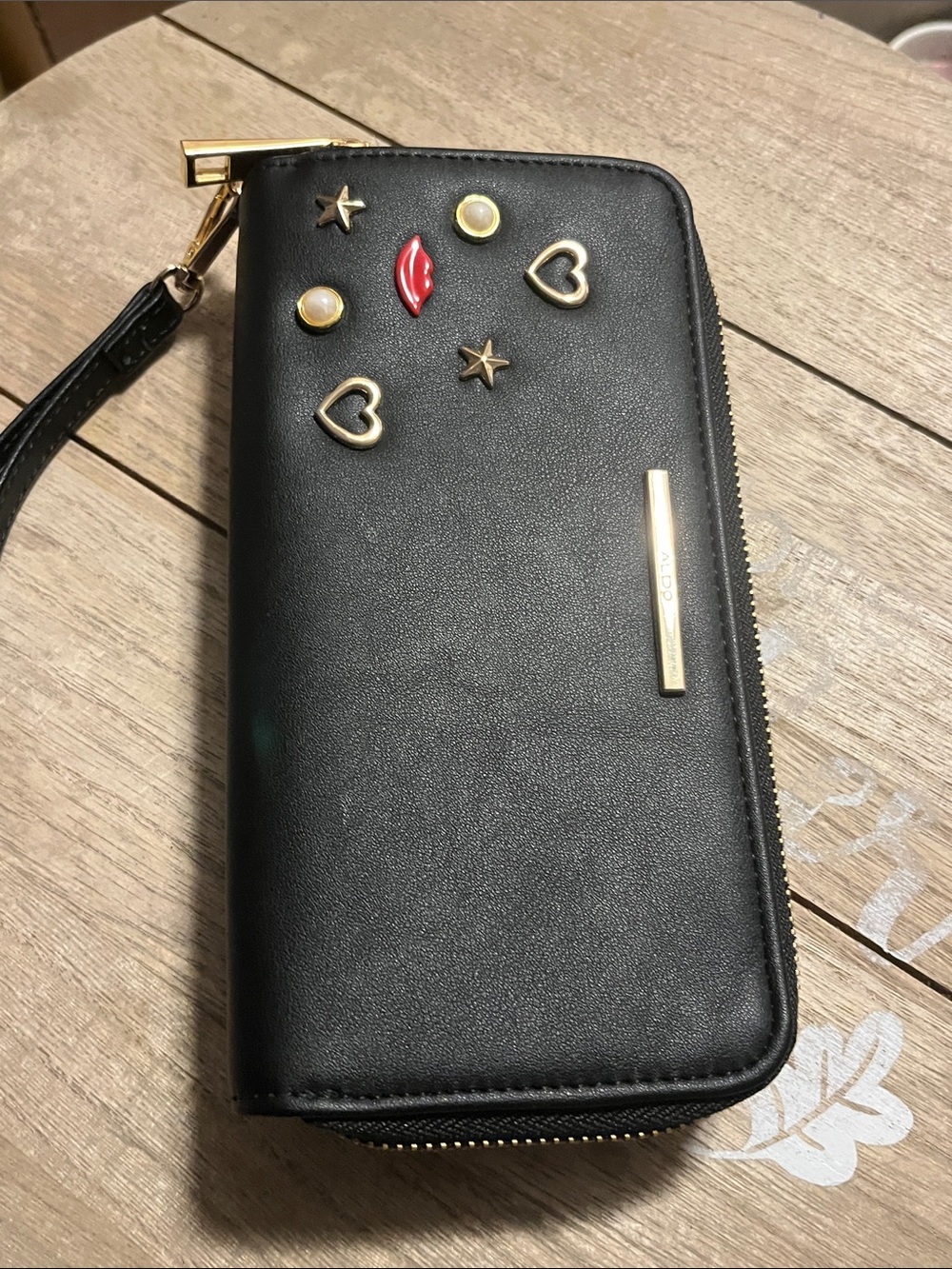 Aldo Black Zip-Around Wristlet Wallet with Gold Accents and Red Lip Charm